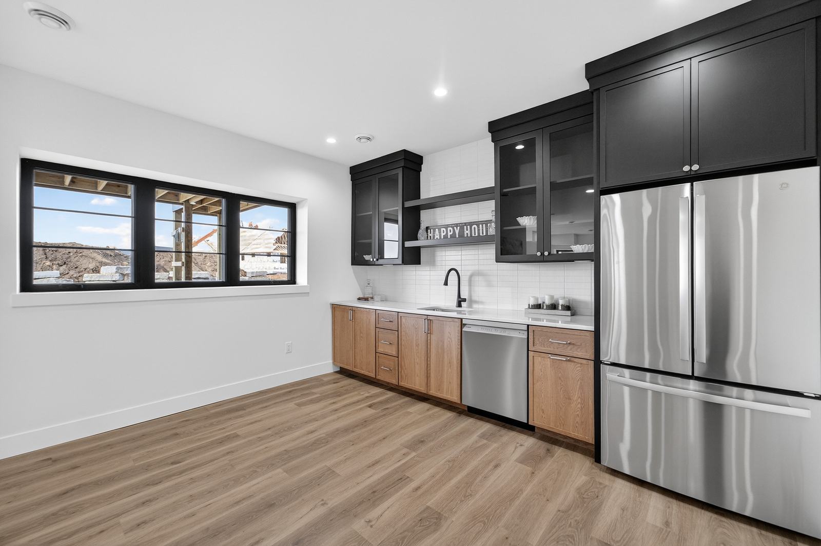 Lower level wet bar with oak cabinets